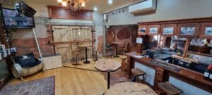 inside the bar at grand ridge brewery show the bar, stools and tables