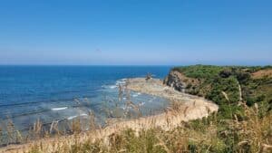 view of a beach with rocky cliffs in Inverloch