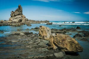 large rock formation in the water