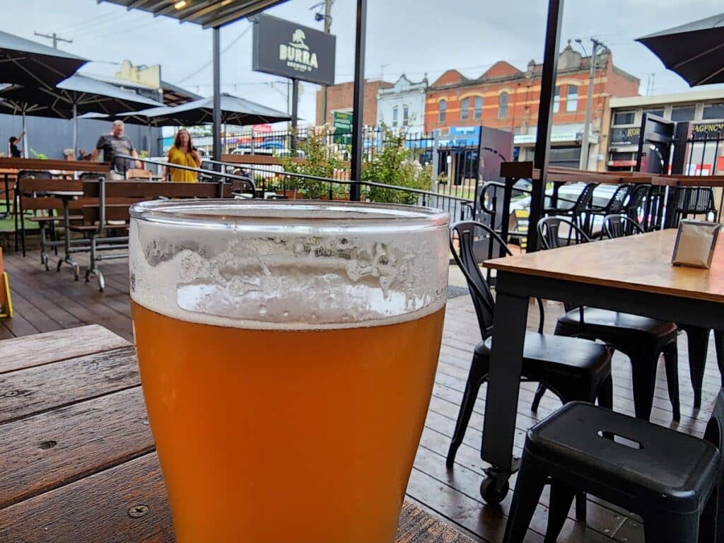 Korumburra Brewing Co beer with signage in background