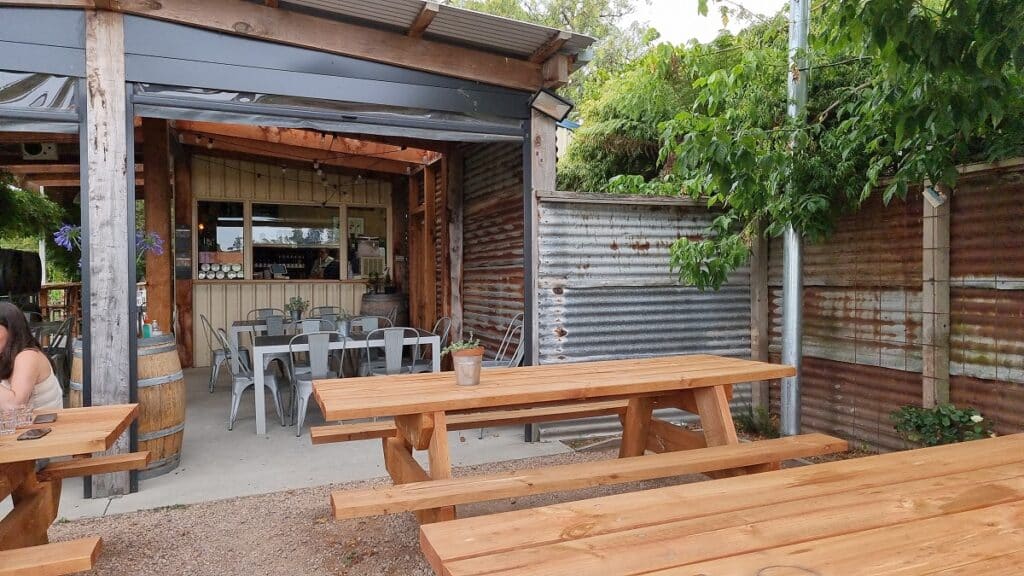 wooden tables looking in to Loch Wine Company - South Gippsland wineries