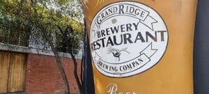 sign of grand ridge brewery shows a huge glass of beer