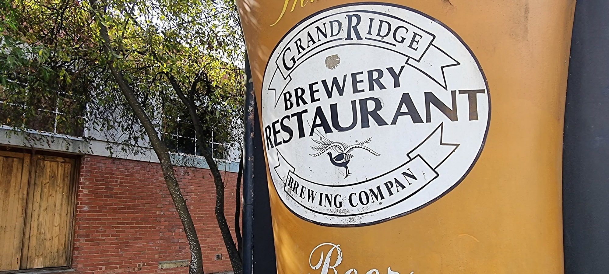 sign of grand ridge brewery shows a huge glass of beer