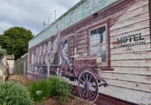 murals showing barrels of beer on the back of a cart