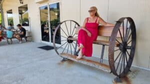 sitting on an old wooden bench 