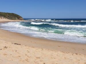 waves crashing into shore at Kilcunda Beach