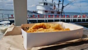 a close up of a serving of fish and chips at Port Albert