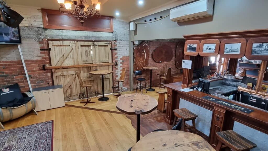 the bar at Grand Ridge Brewery with wooden bar tables