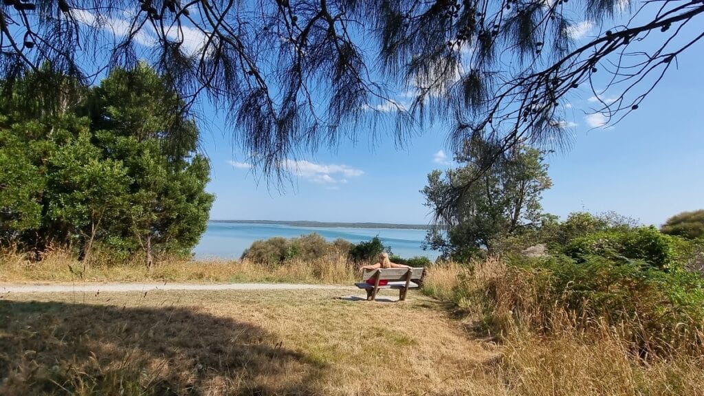 sitting an a bench seat overlooking Andersons Inlet in Inverloch