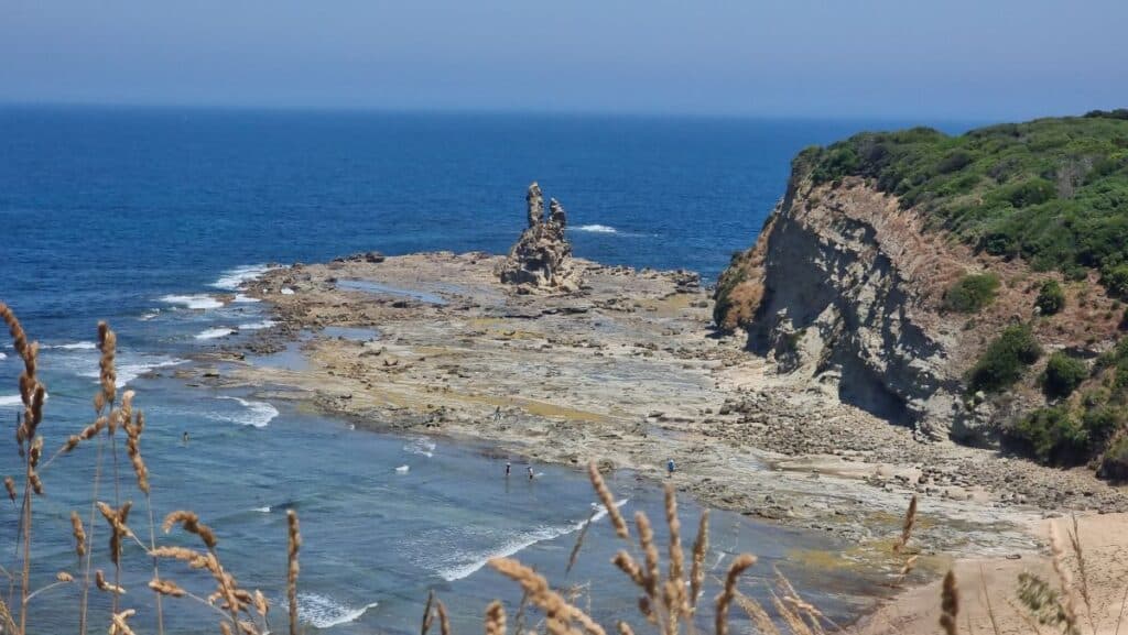 a view looking down to the rocky formation known as Eagles Nest in Inverloch