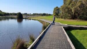 Standing on a boardwalk overlooking the lake at Wonthaggi Wetlands Reserve